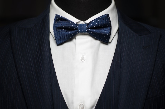 Elegant tuxedo suit with bow tie on mannequin