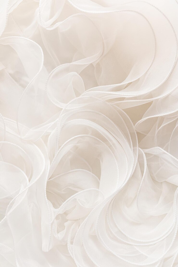 Photo elegant vertical background of the bride's wedding dress part large ruffles of silk fabric in the color of ivory wedding background for text