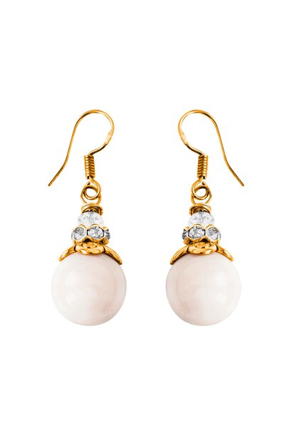 Elegant vintage white pearl and crystal gold earrings isolated over white