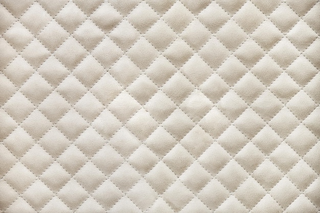 Photo elegant wardrobe facades covered with light beige alcantara quilted by rhomb pattern close view