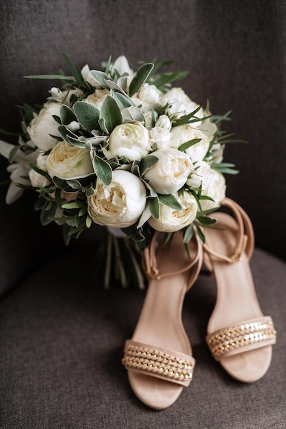 Elegant wedding bouquet of fresh natural flowers and greenery