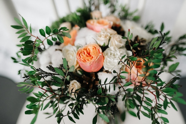 Elegant wedding bouquet of fresh natural flowers and greenery