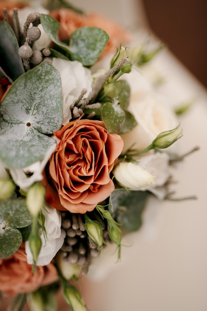 Elegant wedding bouquet of fresh natural flowers and greenery