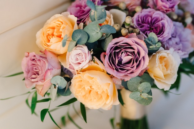 Elegant wedding bouquet of fresh natural flowers and greenery