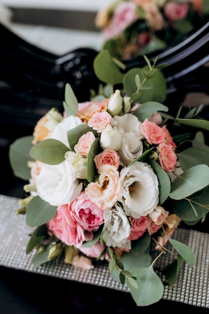 Elegant wedding bouquet of fresh natural flowers and greenery