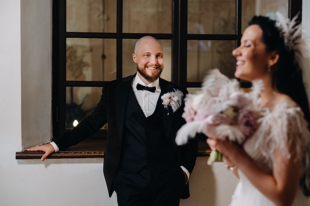 Elegant wedding couple in the interior of the old castle in the city of Nesvizh