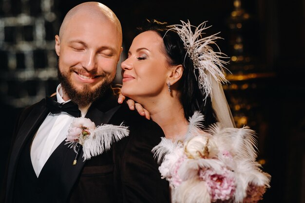 Elegant wedding couple in the interior of the old castle in the city of Nesvizh.