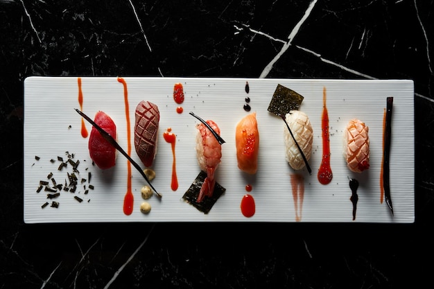 Elegant white plate of sushi pieces Nigiri Flat view Food concept