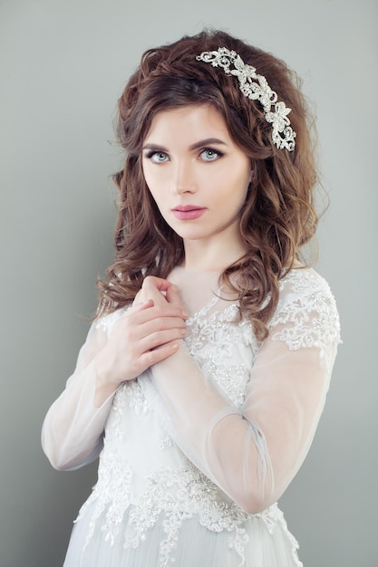 Elegant woman bride with bridal hair and makeup fashion portrait