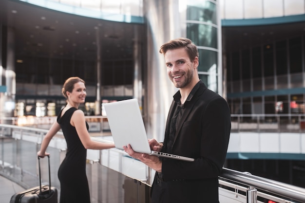 Elegant woman and man working at the airport