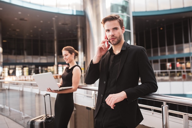 Photo elegant woman and man working at the airport