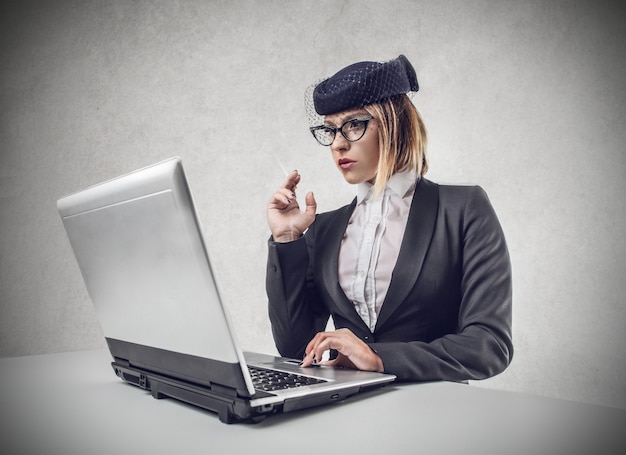 Elegant woman using a laptop