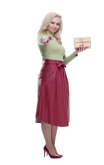 Elegant woman with a gift box pointing at you