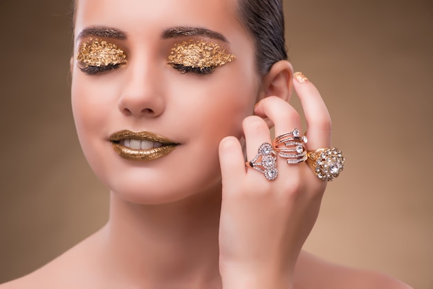 Elegant woman with jewellery in fashion concept