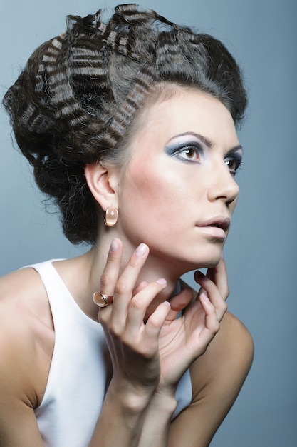 Elegant woman with luxury make up and hairstyle