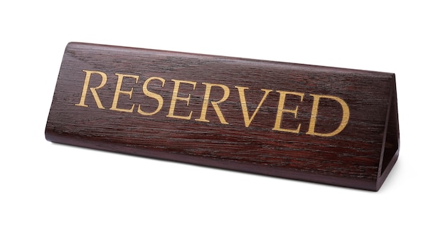 Photo elegant wooden reserved table sign isolated on white