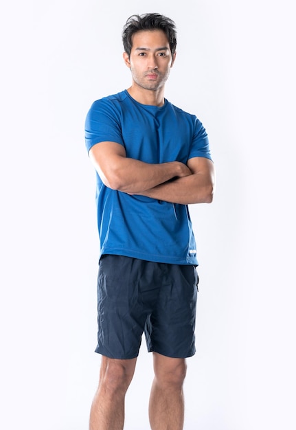 Elegant young man in blue shirt standing on white background