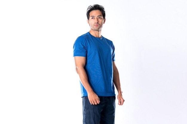 Elegant young man in blue shirt standing on white background