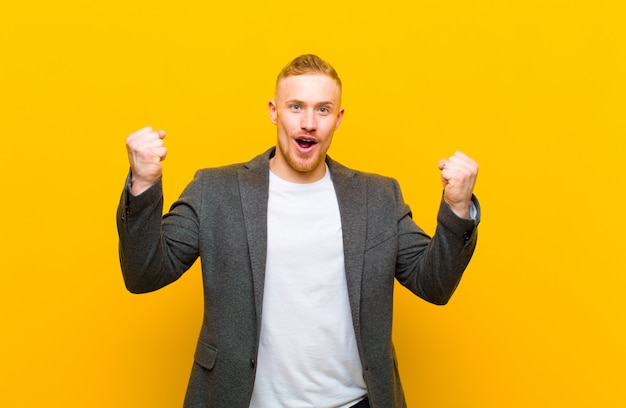 elegant young man feeling successful