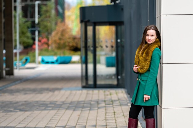 Elegantly dressed business woman at an office building in a financial district