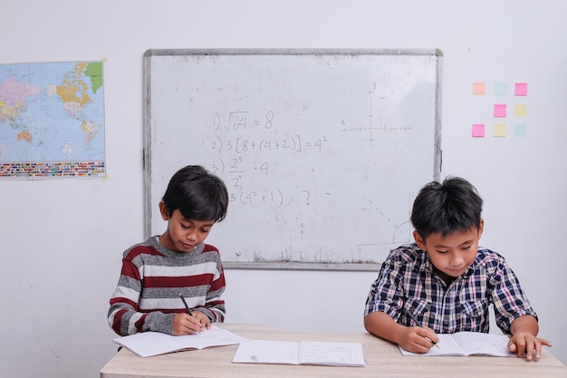 Elementary students having test at the classroom