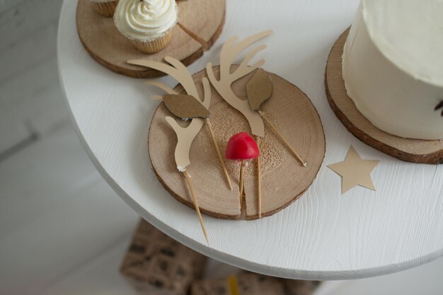 The elements for decorating a Christmas cake are on a white table