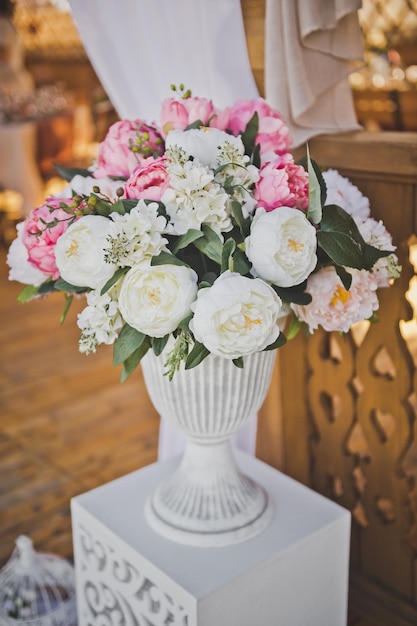 Elements of decoration of the festive hall in the form of bouquets of flow