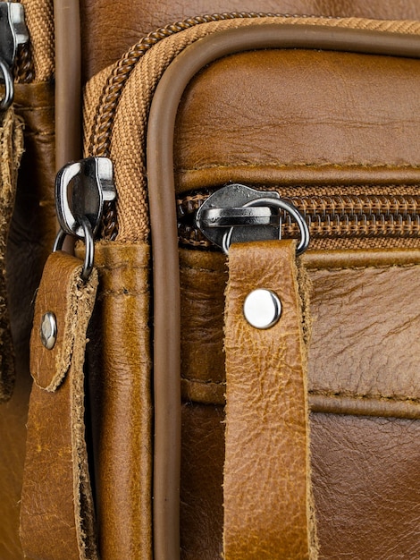 Elements on the leather product belts fasteners fasteners\
zippers closeup image on light background