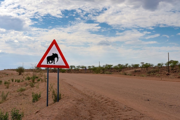 Elephant crossing warning road sign placed in the desert of Namibia