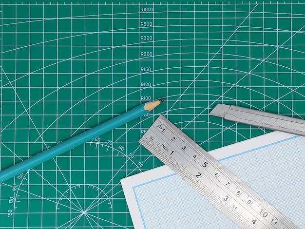 Elevated view of green cutting mat and stationary