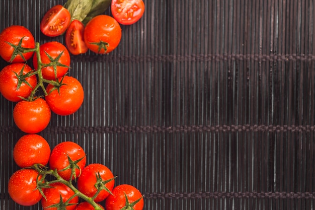 Elevated view of juicy red tomatoes on placemat