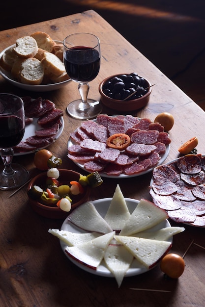 Elevated wiew wine and food on wooden table background