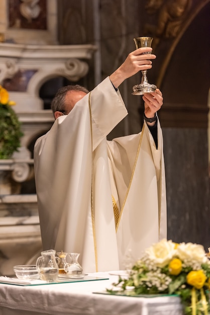 The elevation of the Goblet with the sacramental wine during the Catholic Liturgy of the Eucharist