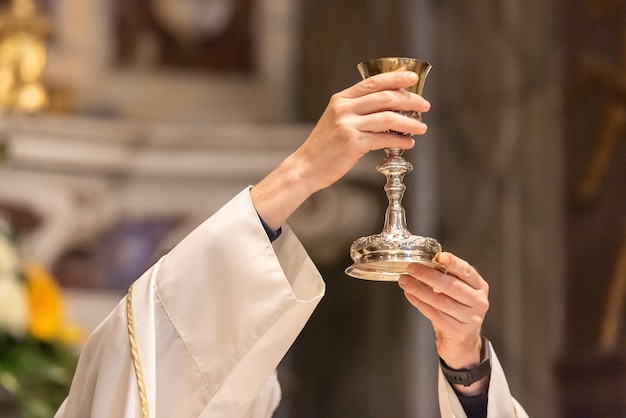 The elevation of the Goblet with the sacramental wine during the Catholic Liturgy of the Eucharist