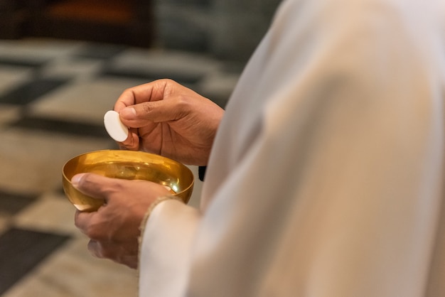 Photo the elevation of the sacramental bread during the catholic liturgy