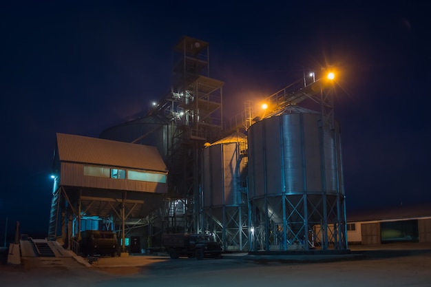 Elevator at night sometimes performs work on receiving, cleaning, drying and storing grain