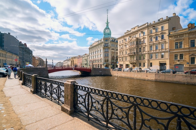 Embankment of the Moyka river, Red bridge, Zinger house in St. Petersburg.