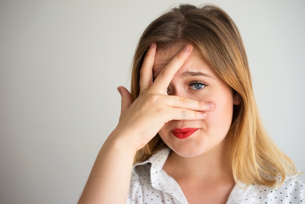 Embarrassed displeased woman feeling ashamed 