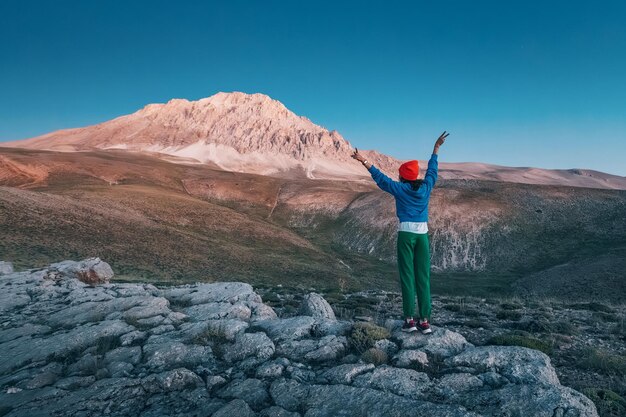 Embracing the peaks a nature enthusiast hikes through mountains chasing adventure and embodying a freespirited outdoor lifestyle