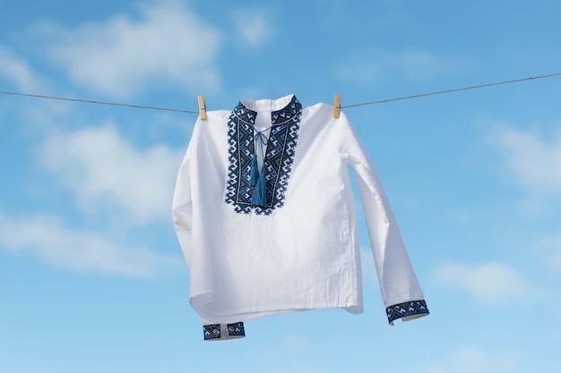 Embroidered shirt and blue sky