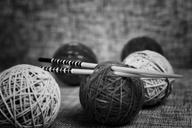 Embroidery wool balls and knitting needles