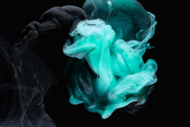 Emerald abstract background luxury smoke acrylic paint underwater explosion cosmic swirling aquamarine ink