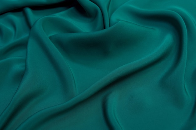 Emerald color silk fabric waves texture