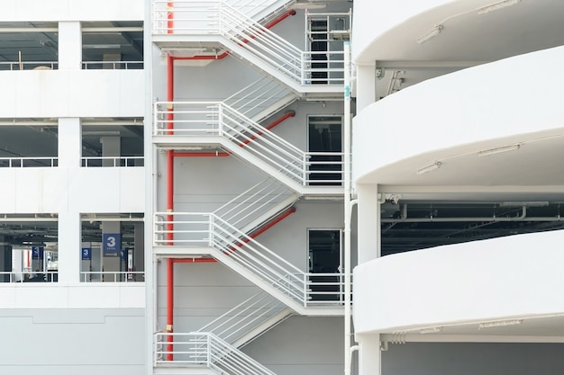 Emergency exit staircase with white walls. newly constructed parking garage