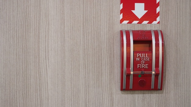 Emergency of Fire alarm or alert or bell warning equipment in red color at the building for safety.