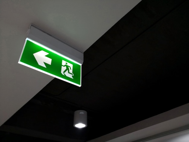 Photo emergency fire exit sign show the way to escape.