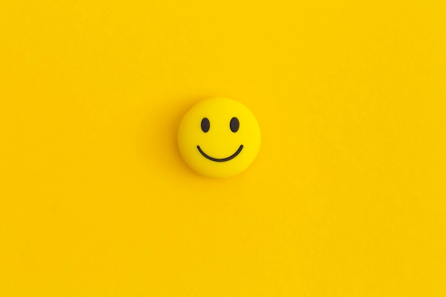 Photo emoticon smile on a yellow background