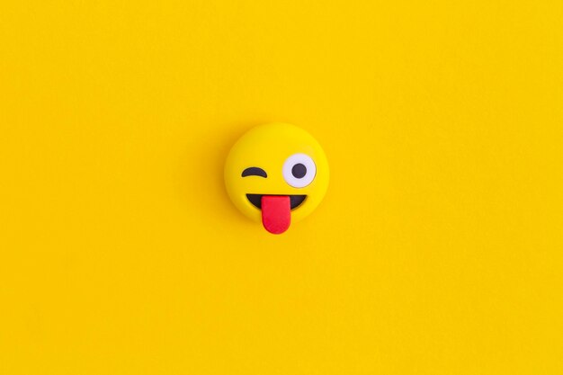 Photo emoticon smile on a yellow background