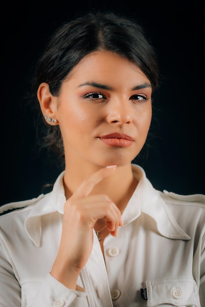 Emotion Curiosity Portrait of a beautiful curious young woman expressing curiosity studio portrait black background