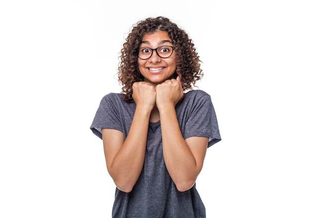 Emotion of joy on the face of a mixed race girl on white. 